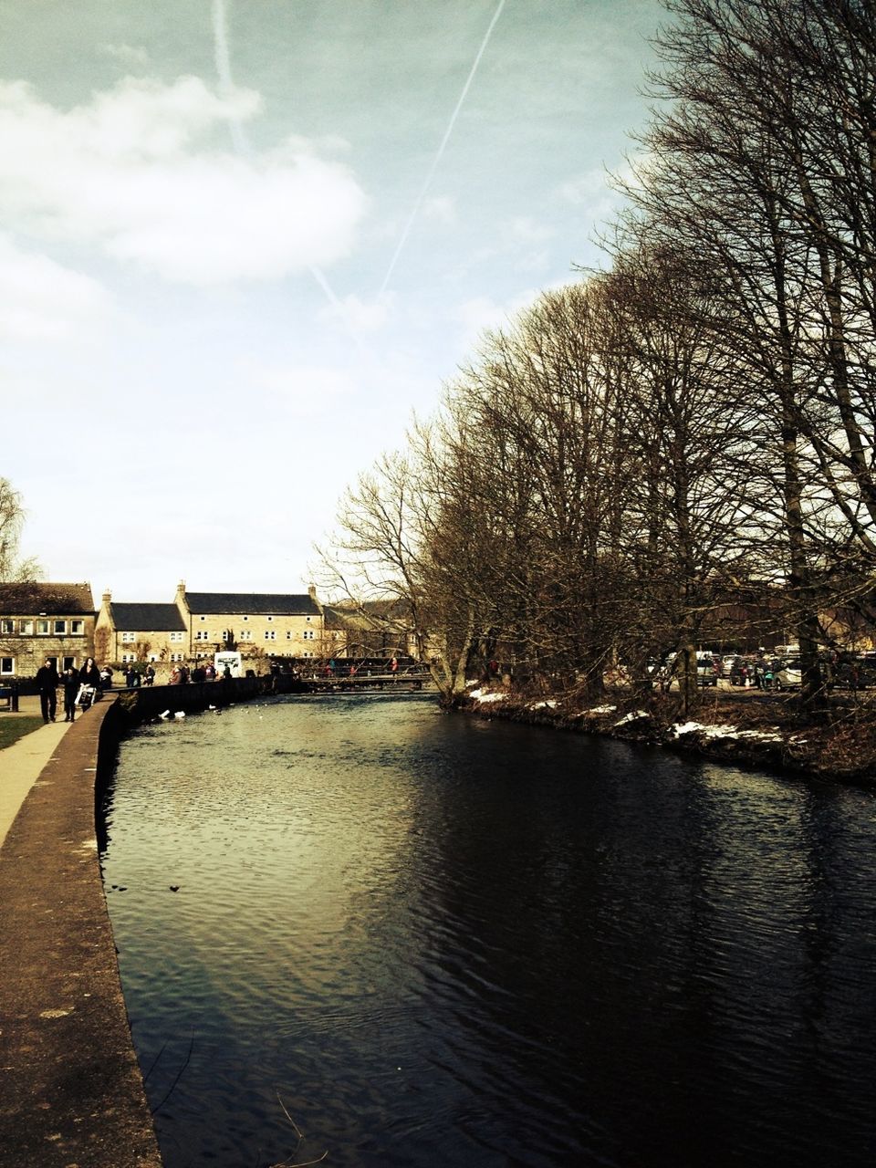 water, tree, sky, river, waterfront, built structure, architecture, lake, cloud - sky, building exterior, tranquility, tranquil scene, rippled, nature, cloud, reflection, day, bare tree, scenics, incidental people