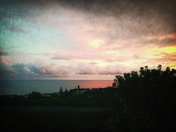 Scenic view of sea against sky at sunset