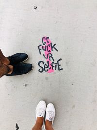 Low section of man standing on floor