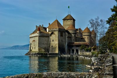 Chateau montreux switzerland building by lake against sky