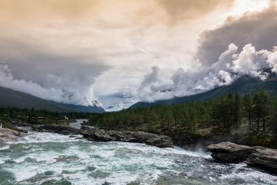 Scenic view of river against sky