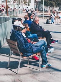 People sitting on bench in park