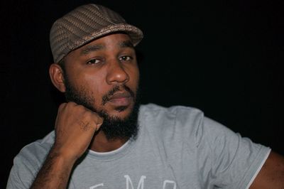 Portrait of mid adult man against black background