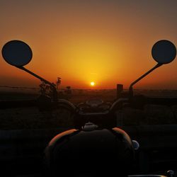 Silhouette hot air balloon against sky during sunset