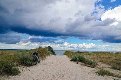 Scenic view of landscape against cloudy sky