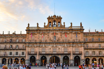 Group of people in front of historical building