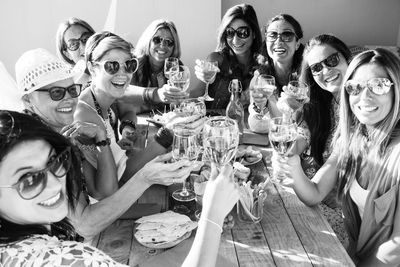 Group of people drinking glasses on table