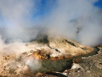 Smoke emitting from volcanic mountain