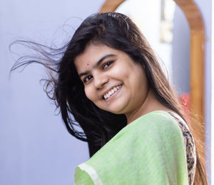 Portrait of a beautiful indian woman in green saree