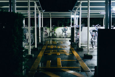 People at illuminated railroad station at night