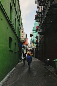 Rear view of man walking in city