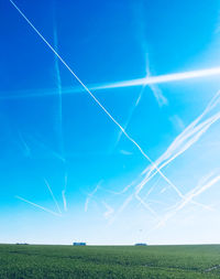 Low angle view of vapor trails in sky