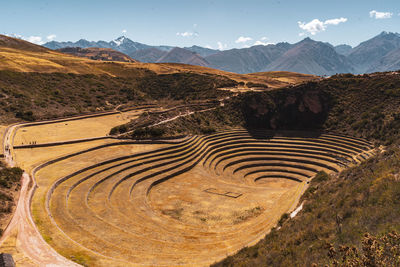 Scenic view of agricultural field against mountain