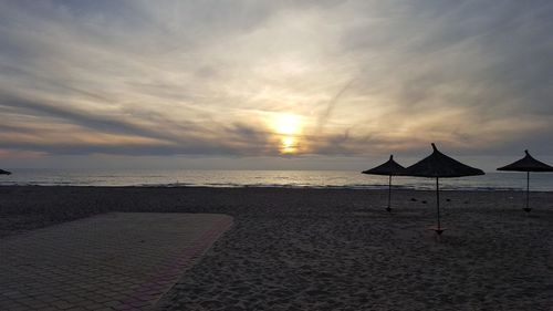 View of beach against cloudy sky