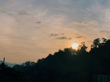 Low angle view of silhouette trees against sky during sunset