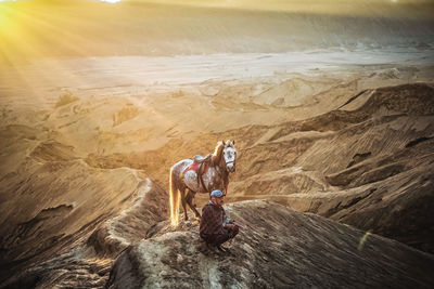 Man riding motorcycle on rock