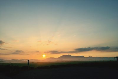 Scenic view of landscape at sunset