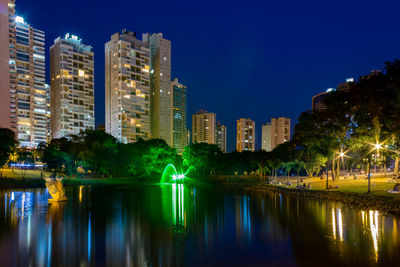 Reflection of illuminated buildings in water at night