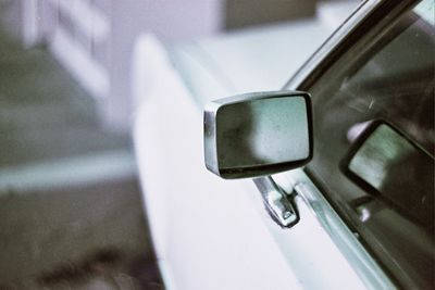 Close-up of vintage car on side-view mirror