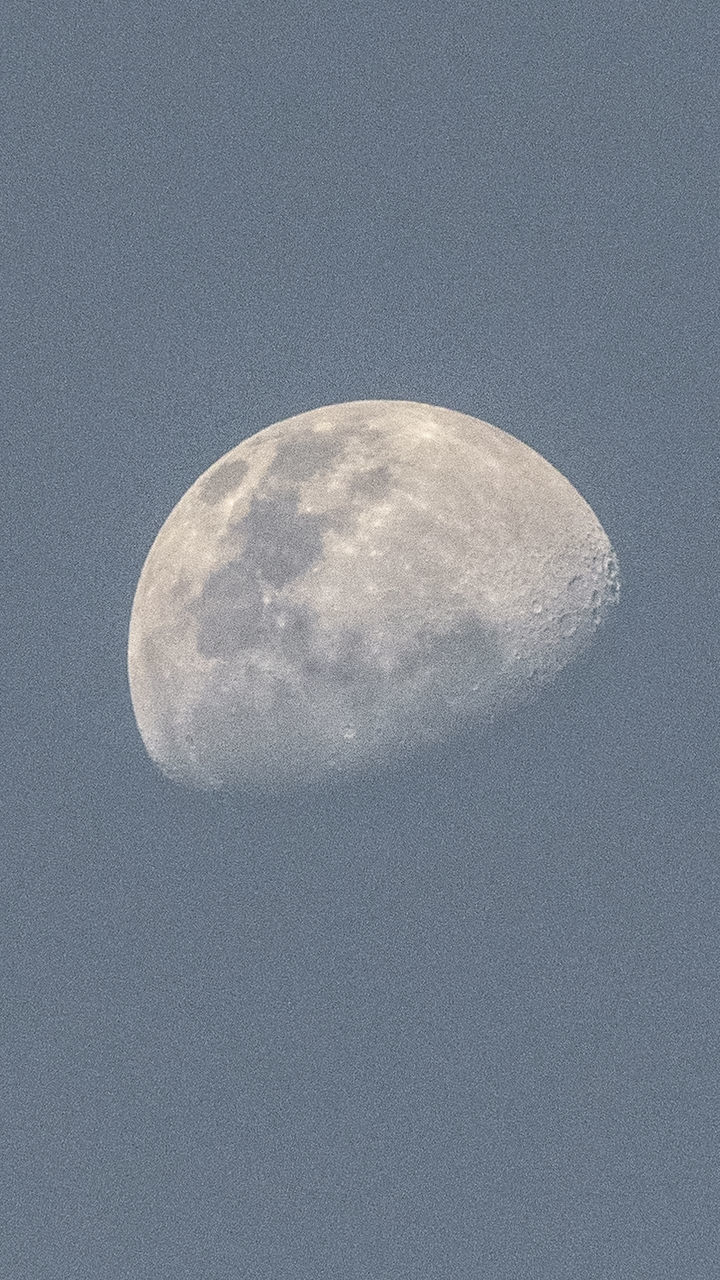 LOW ANGLE VIEW OF MOON AGAINST CLEAR SKY