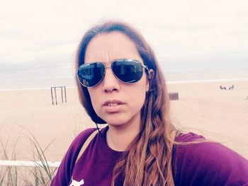 Portrait of woman standing on beach