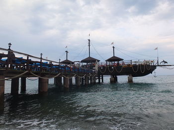 Pier over sea against sky