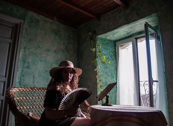 Man sitting on chair at home