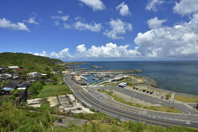 High angle view of road by sea against sky