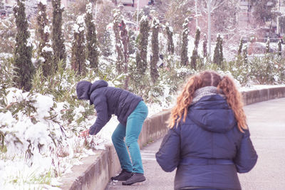 Rear view of women in winter