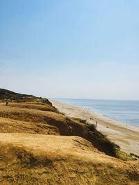 Scenic view of beach against clear sky