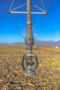 Close-up of coin-operated binoculars against clear sky