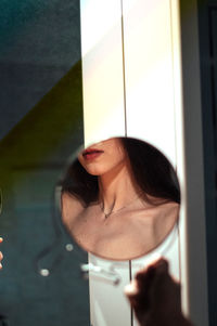 Reflection of woman in mirror