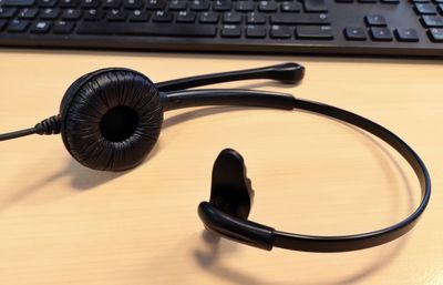 High angle view of headphones and keyboard on table