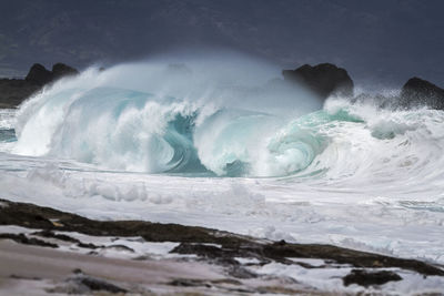 View of waves in sea against sky