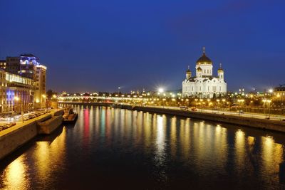 Illuminated buildings in city at night