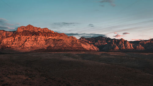 Scenic view of landscape against sky during sunset