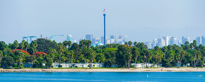 View of trees and buildings against sky