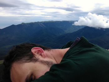 Cropped image of man against mountains