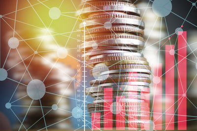 Double exposure image of coins and connecting dots