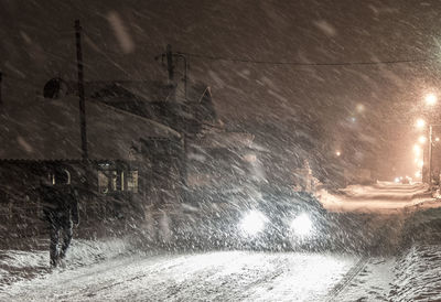 Snow covered street at night