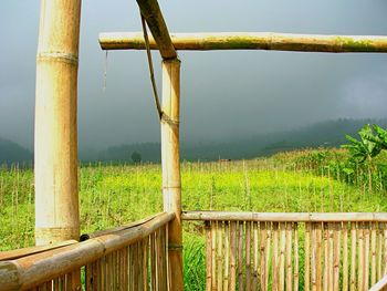 Wooden fence on field