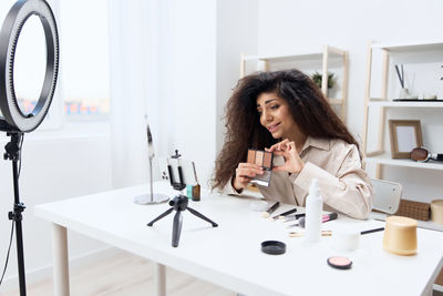 Portrait of young woman working at clinic