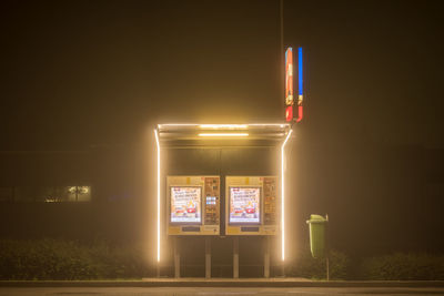 View of illuminated lights on road