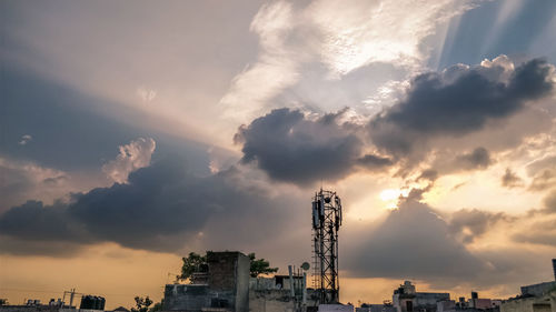 Low angle view of buildings against sky during sunset