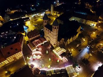 Aerial view of illuminated city at night