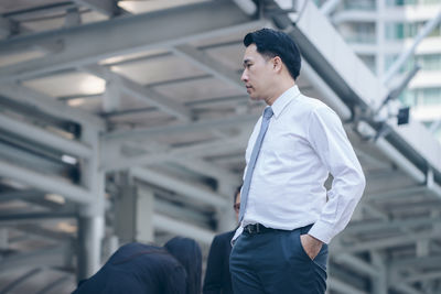 Businessman standing in city