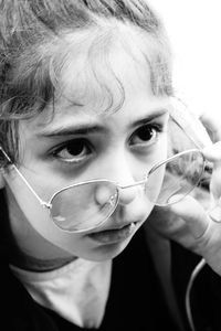 Close-up portrait of cute boy drinking