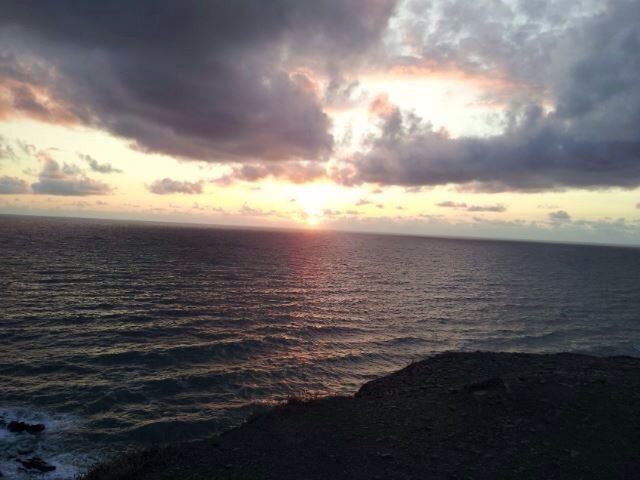 sea, water, beach, horizon over water, sky, tranquil scene, scenics, shore, tranquility, beauty in nature, sunset, cloud - sky, nature, sand, idyllic, coastline, cloud, wave, reflection, cloudy