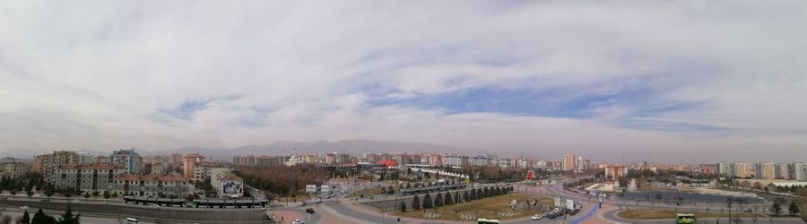 Aerial view of cityscape against sky