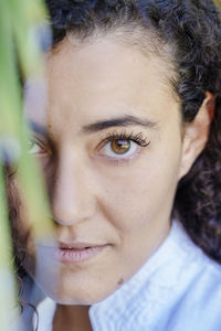 Close-up portrait of smiling young woman